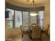 Cozy dining area with ample windows, a chandelier, and comfortable seating at 7318 E Woodsage Ln, Scottsdale, AZ 85258