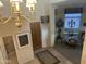 Welcoming foyer showcasing a chandelier, elegant rug, and entry to the dining area with bright light at 7318 E Woodsage Ln, Scottsdale, AZ 85258