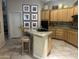 Well-lit kitchen with granite countertops, a breakfast bar, and stylish décor at 7318 E Woodsage Ln, Scottsdale, AZ 85258