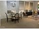 Bright living room featuring neutral tones, plush rug, and dining area with elegant chandelier at 7318 E Woodsage Ln, Scottsdale, AZ 85258