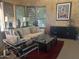 Inviting living room with natural light streaming through the windows, furnished with cozy seating and stylish decor at 7318 E Woodsage Ln, Scottsdale, AZ 85258