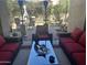 Inviting outdoor patio with comfortable seating, offering a relaxing space surrounded by lush greenery at 7318 E Woodsage Ln, Scottsdale, AZ 85258