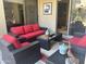 Stylish outdoor patio area with comfortable seating, a modern table, and access to interior spaces at 7318 E Woodsage Ln, Scottsdale, AZ 85258
