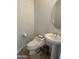 Efficient powder room features a toilet and pedestal sink at 7318 E Woodsage Ln, Scottsdale, AZ 85258