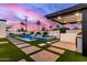 Outdoor oasis featuring a pool, spa, BBQ area, and desert landscaping at 7325 E Virginia Ave, Scottsdale, AZ 85257