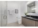 Modern bathroom featuring a sink, vanity, and tiled shower at 7325 E Virginia Ave, Scottsdale, AZ 85257