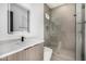 Bright bathroom with marble tile, sink and lighted mirror at 7325 E Virginia Ave, Scottsdale, AZ 85257