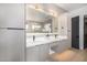Stylish bathroom with dual vanities, modern fixtures, and a large glass-enclosed shower at 7325 E Virginia Ave, Scottsdale, AZ 85257