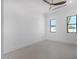 Bright bedroom with light walls and a ceiling fan at 7325 E Virginia Ave, Scottsdale, AZ 85257
