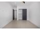 Minimalist bedroom with bright white walls and closet at 7325 E Virginia Ave, Scottsdale, AZ 85257
