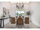 Contemporary dining room with modern lighting fixture and view to the outdoors at 7325 E Virginia Ave, Scottsdale, AZ 85257