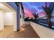 Outdoor balcony with desert landscaping and a pink and purple sunset at 7325 E Virginia Ave, Scottsdale, AZ 85257