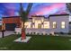 Modern home boasts striking architecture, lush landscaping, and inviting curb appeal at 7325 E Virginia Ave, Scottsdale, AZ 85257