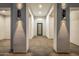 Bright foyer with modern lighting fixtures and a sleek front door at 7325 E Virginia Ave, Scottsdale, AZ 85257
