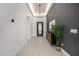 Hallway view showing modern interiors, decorative wall paneling, and a decorative plant at 7325 E Virginia Ave, Scottsdale, AZ 85257