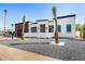 Well-lit facade with palm trees and modern landscaping that enhance its curb appeal at 7325 E Virginia Ave, Scottsdale, AZ 85257