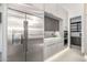 Contemporary kitchen featuring stainless steel refrigerator and modern cabinetry, with built in oven and undermount lighting at 7325 E Virginia Ave, Scottsdale, AZ 85257