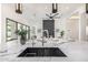 Modern kitchen with marble counters, sleek fixtures, and a bright, open floor plan to the living space at 7325 E Virginia Ave, Scottsdale, AZ 85257