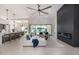 Bright living room with modern fireplace and large sliding glass doors to the outdoor space at 7325 E Virginia Ave, Scottsdale, AZ 85257