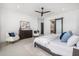 Airy bedroom offers modern decor and access to the en suite bathroom with a sliding door at 7325 E Virginia Ave, Scottsdale, AZ 85257