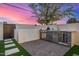 Enjoy this outdoor kitchen equipped with a stainless steel grill, beverage cooler, and bar sink at 7325 E Virginia Ave, Scottsdale, AZ 85257