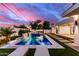 Lush backyard with a pool and outdoor cooking space, perfect for summer gatherings and relaxation at 7325 E Virginia Ave, Scottsdale, AZ 85257