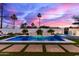 Tranquil pool with spa featuring stone accents, surrounded by lush landscaping, creating a private retreat at 7325 E Virginia Ave, Scottsdale, AZ 85257