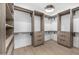 Spacious walk-in closet with custom shelving and drawers and natural light at 7325 E Virginia Ave, Scottsdale, AZ 85257