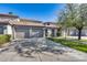 Inviting condo with multiple car parking and a green front yard displaying an attractive entryway under a sunny sky at 7401 W Arrowhead Clubhouse Dr # 2007, Glendale, AZ 85308