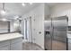 Spacious kitchen with stainless steel appliances, and access to living room area at 7401 W Arrowhead Clubhouse Dr # 2007, Glendale, AZ 85308