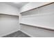 Walk-in closet boasts ample storage with shelving and hanging rods for optimal organization at 7401 W Arrowhead Clubhouse Dr # 2007, Glendale, AZ 85308