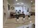 Bright dining room with an elegant chandelier, large table and chairs, and sliding doors to a balcony at 7430 E Chaparral Rd # A243, Scottsdale, AZ 85250