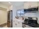 Modern kitchen featuring stainless steel appliances, stylish fixtures, and white cabinetry at 7430 E Chaparral Rd # A243, Scottsdale, AZ 85250