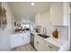 Bright kitchen with white cabinetry, marble countertops, and stainless steel appliances at 7430 E Chaparral Rd # A243, Scottsdale, AZ 85250