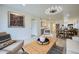 Inviting living room with modern decor, light wood floors and a stylish light fixture at 7430 E Chaparral Rd # A243, Scottsdale, AZ 85250