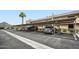 Covered parking area with designated spaces and mature landscaping for a shaded environment at 7430 E Chaparral Rd # A243, Scottsdale, AZ 85250