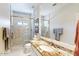 This bathroom features a large mirror, marble floors, and a glass enclosed shower with a rainfall shower head at 7705 E Doubletree Ranch Rd # 36, Scottsdale, AZ 85258