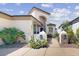 Landscaped front entrance showing desert plants and a unique architectural design with a white pillar accent at 7705 E Doubletree Ranch Rd # 36, Scottsdale, AZ 85258