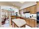 Open kitchen layout with granite counters, an island, and views of the living room at 7705 E Doubletree Ranch Rd # 36, Scottsdale, AZ 85258