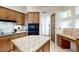 Kitchen featuring wood cabinets, granite countertops, and modern appliances at 7705 E Doubletree Ranch Rd # 36, Scottsdale, AZ 85258