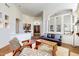 Bright living room with high ceilings, hardwood floors, and a view of the front entrance at 7705 E Doubletree Ranch Rd # 36, Scottsdale, AZ 85258