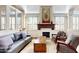 Open-concept living room featuring a fireplace, large windows, hardwood floors, and contemporary decor at 7705 E Doubletree Ranch Rd # 36, Scottsdale, AZ 85258