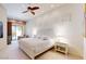 Bright main bedroom with white furniture, a ceiling fan, and patio access at 7705 E Doubletree Ranch Rd # 36, Scottsdale, AZ 85258