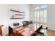 Home office with a large wooden desk, floating shelves, and bright natural light at 7705 E Doubletree Ranch Rd # 36, Scottsdale, AZ 85258