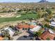 Stunning aerial view of a home with a pool overlooking the manicured golf course at 8262 E Vista De Valle --, Scottsdale, AZ 85255