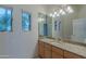 Bright bathroom with granite countertops, a framed mirror, and natural light at 8262 E Vista De Valle --, Scottsdale, AZ 85255