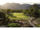Golf course nestled in a community surrounded by natural desert landscape and mountains in the background at 8262 E Vista De Valle --, Scottsdale, AZ 85255