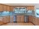 Kitchen featuring custom cabinets, stainless steel appliances, granite counters, and an eat in bar at 8262 E Vista De Valle --, Scottsdale, AZ 85255