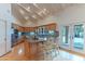 This bright kitchen has custom cabinets, stainless steel appliances, granite counters, and a breakfast bar at 8262 E Vista De Valle --, Scottsdale, AZ 85255