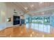 Large living area featuring hardwood floors, fireplace, and golf course views at 8262 E Vista De Valle --, Scottsdale, AZ 85255